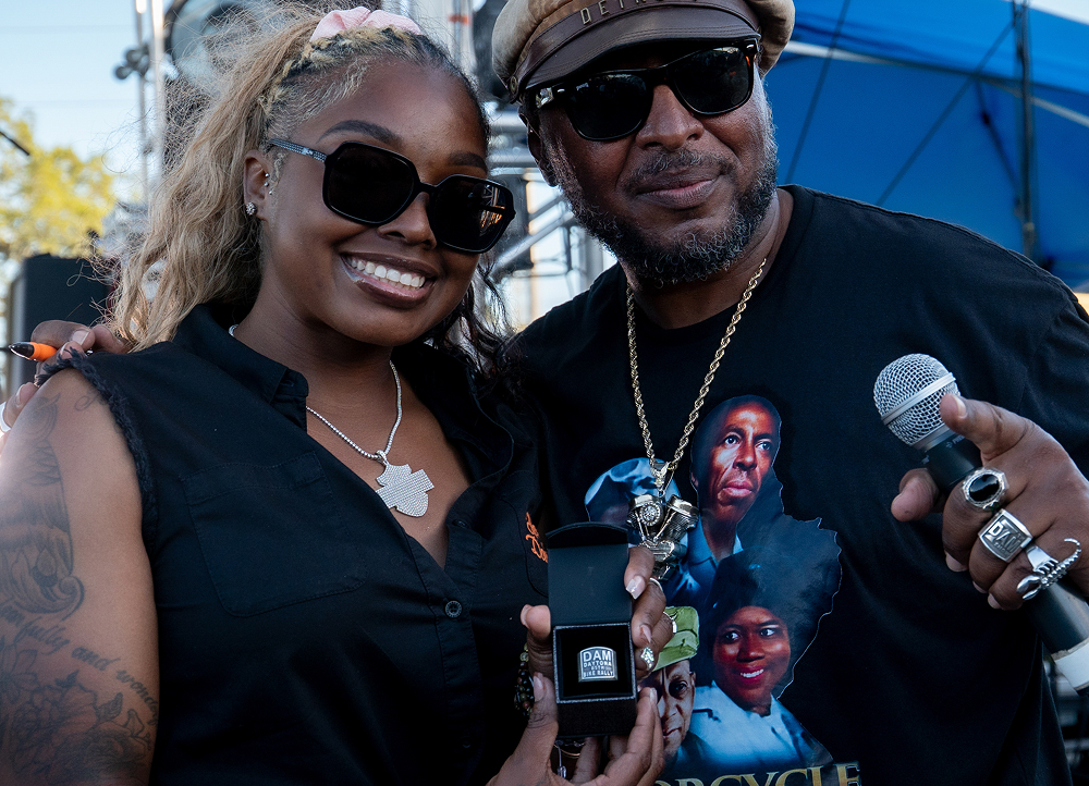 Randy “Detroit” Hayward poses with a bike builder after awarding them a DAM ring