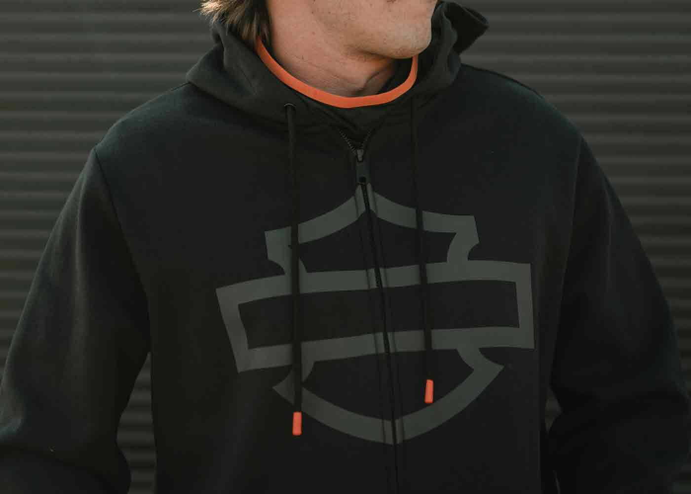 man wearing a black zip up hoodie