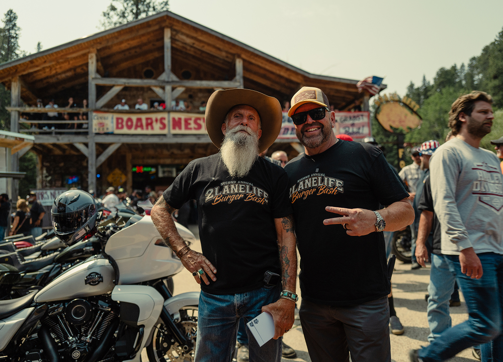 Motorcycle enthusiasts gather outside the Boar’s Nest during the popular 2Lane Life Burger Bash event