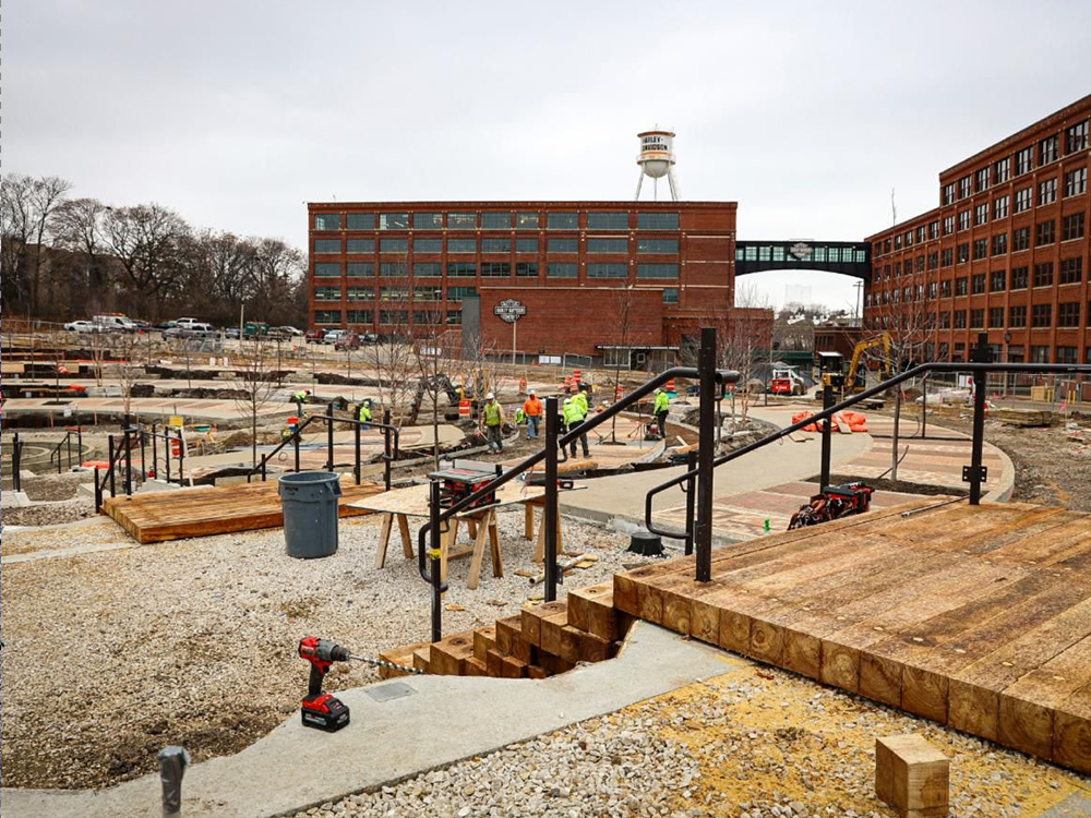 Construction work in progress at Harley-Davidson campus with equipment and pathways