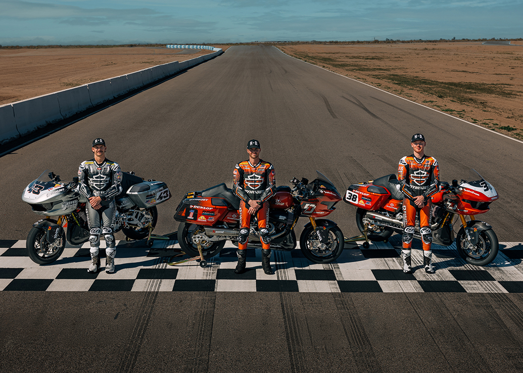 H-D Racing team members on starting line with motorcycles