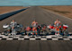 H-D Racing team members on starting line with motorcycles