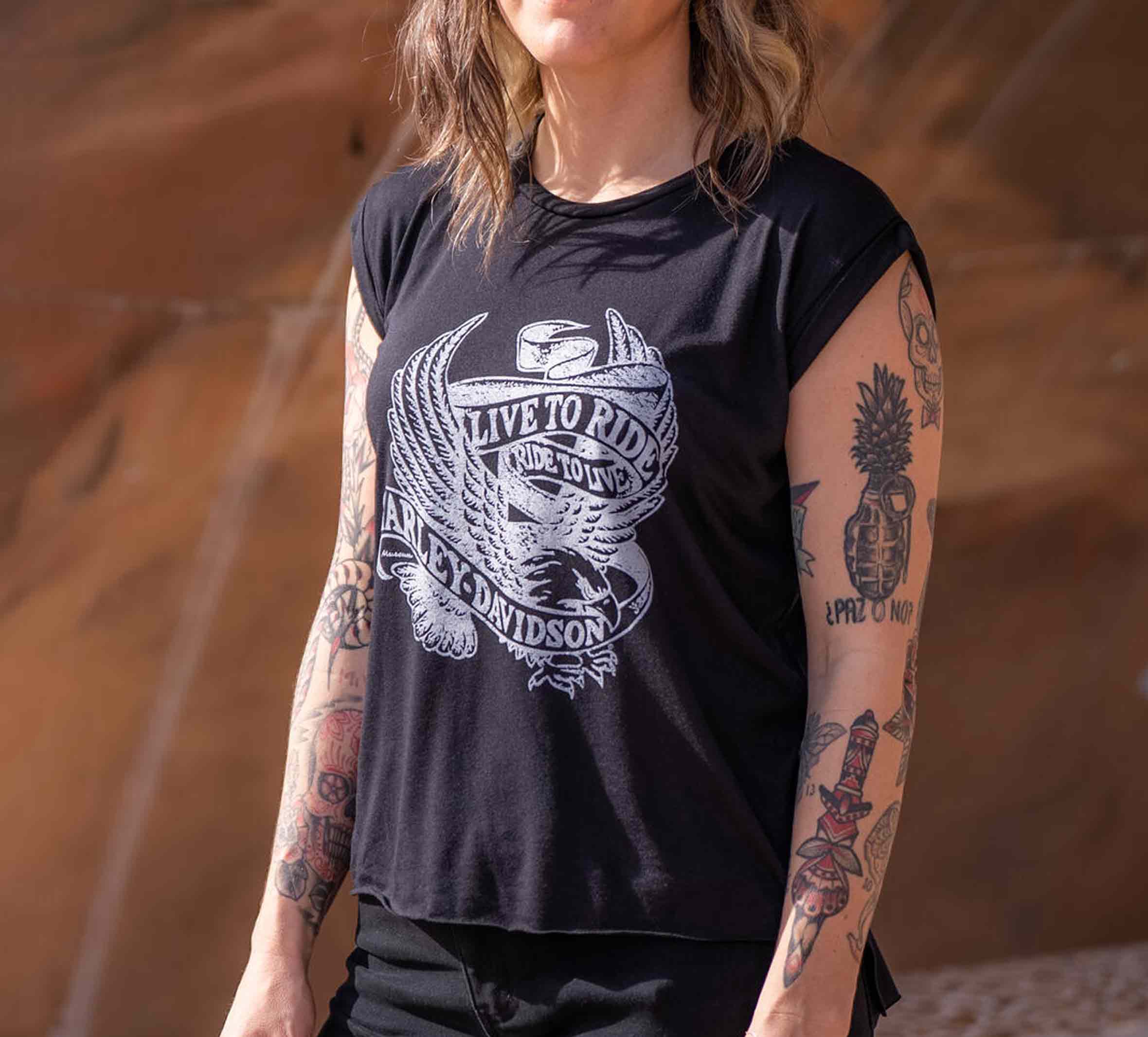 woman wearing pink short-sleeve tee with Milwaukee printed on back
