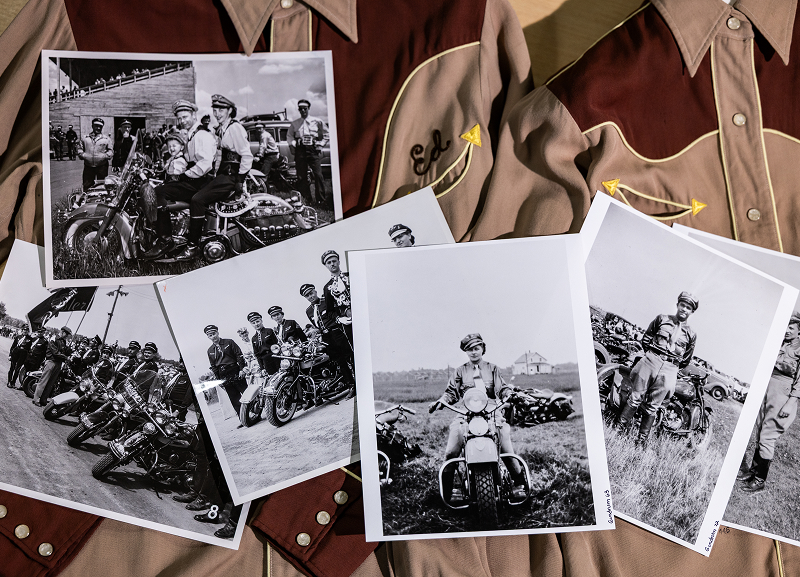Vintage black-and-white photographs of motorcycle riders and events scattered across embroidered western shirts