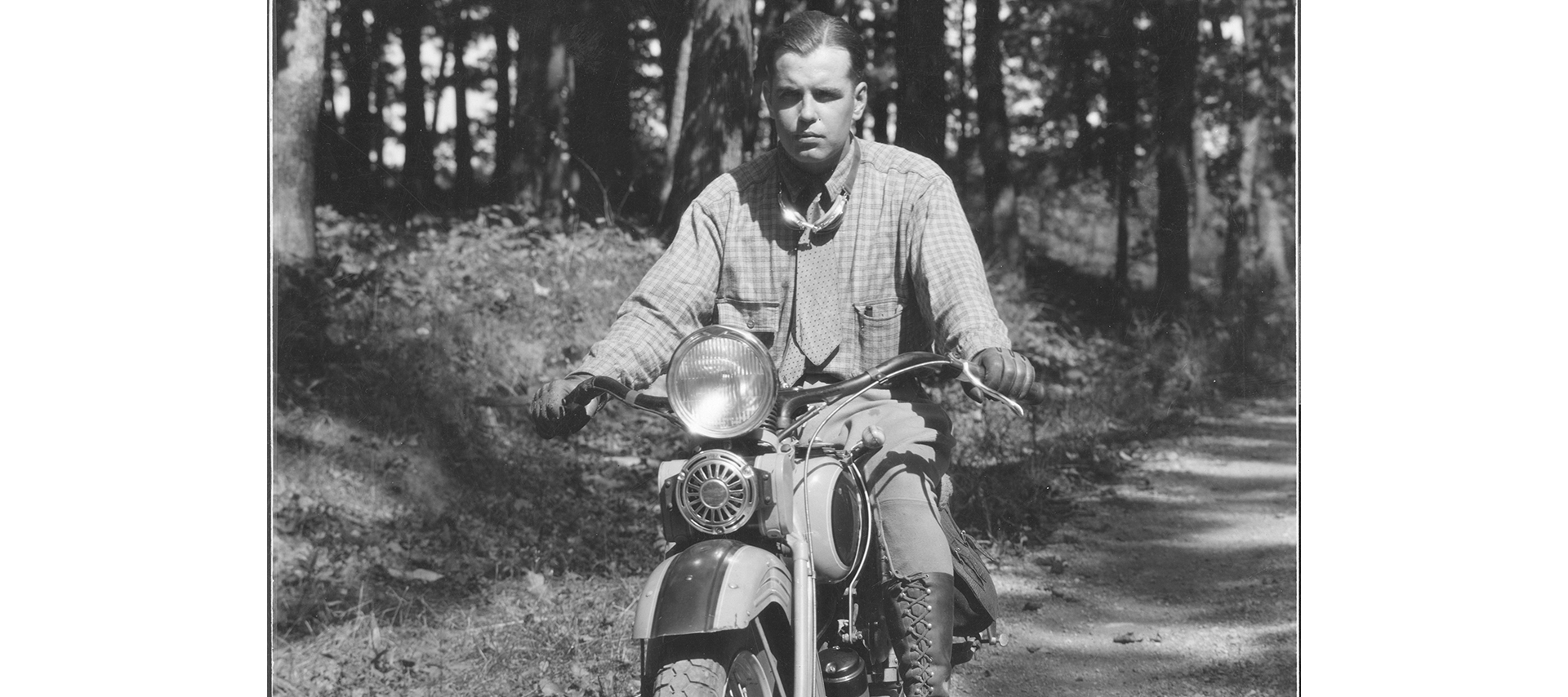 A man rides down a dirt trail 