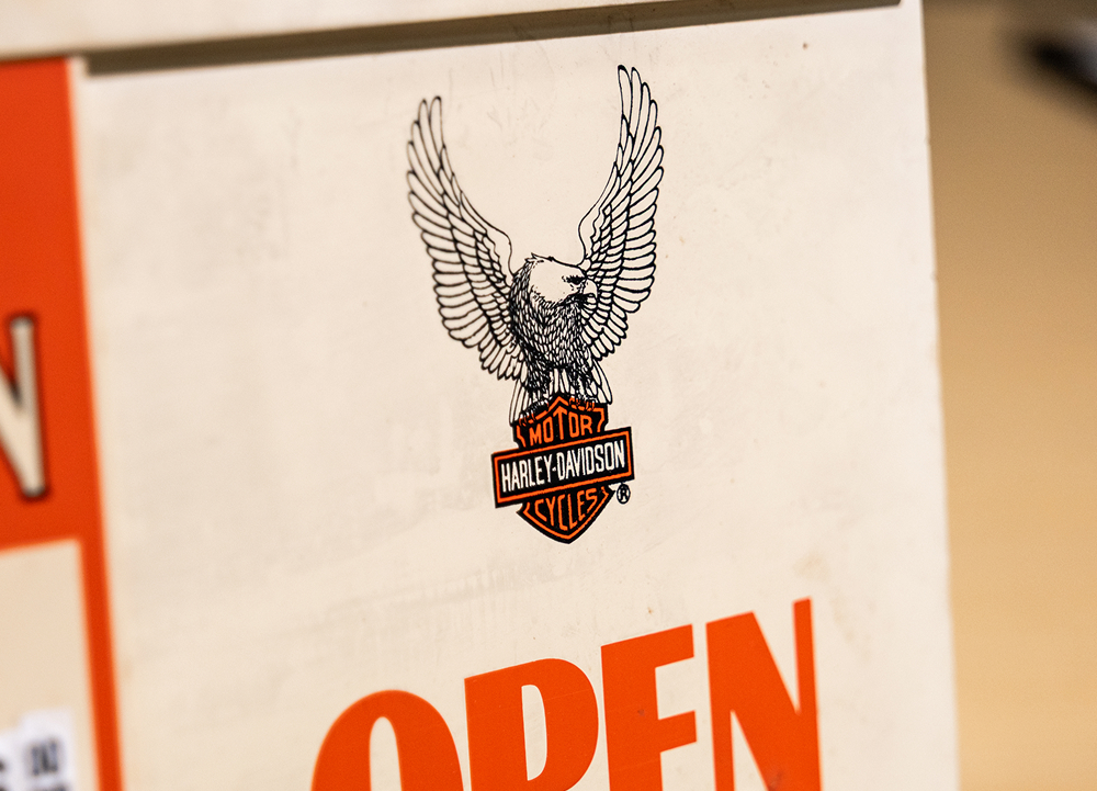 Eagle and Bar & Shield artwork displayed on a Harley-Davidson dealership sign and banner