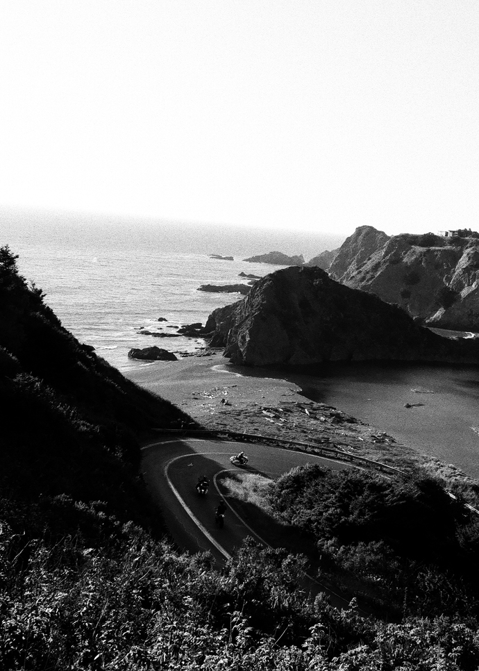 Bikers ride through curved road near California’s Lost Coast 