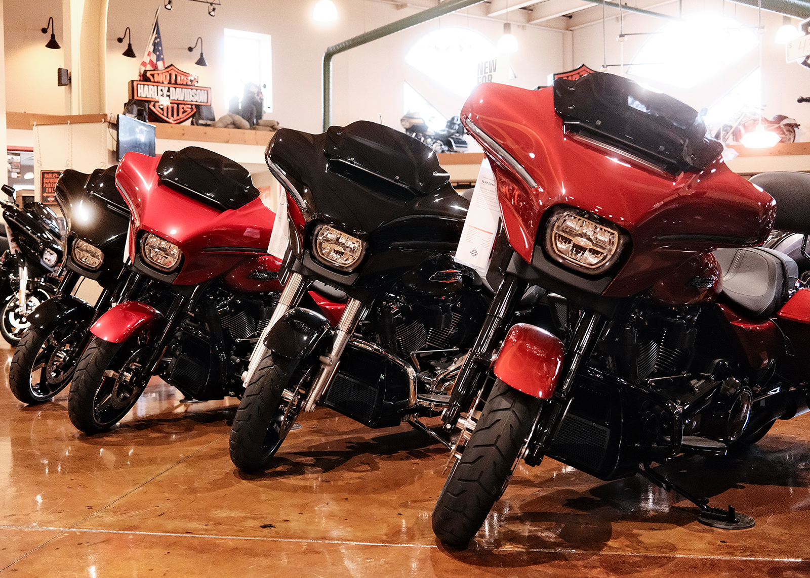 A lineup of new Street Glide motorcycles on the showroom floor at Classic Harley-Davidson.