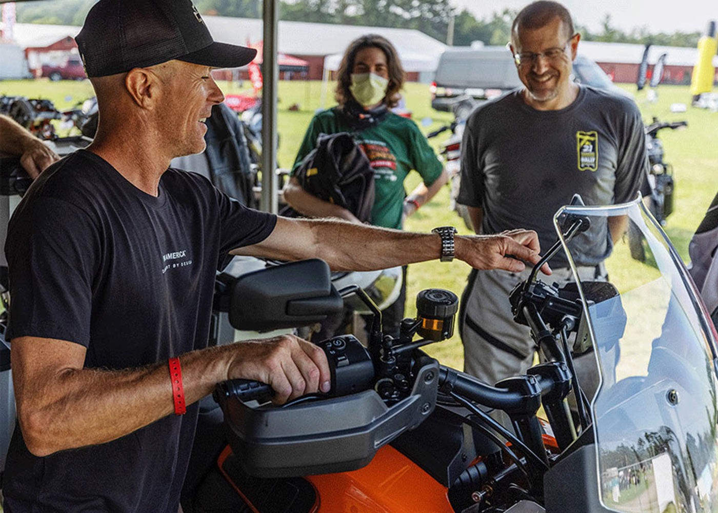 man demonstrating pan am motorcycle features
