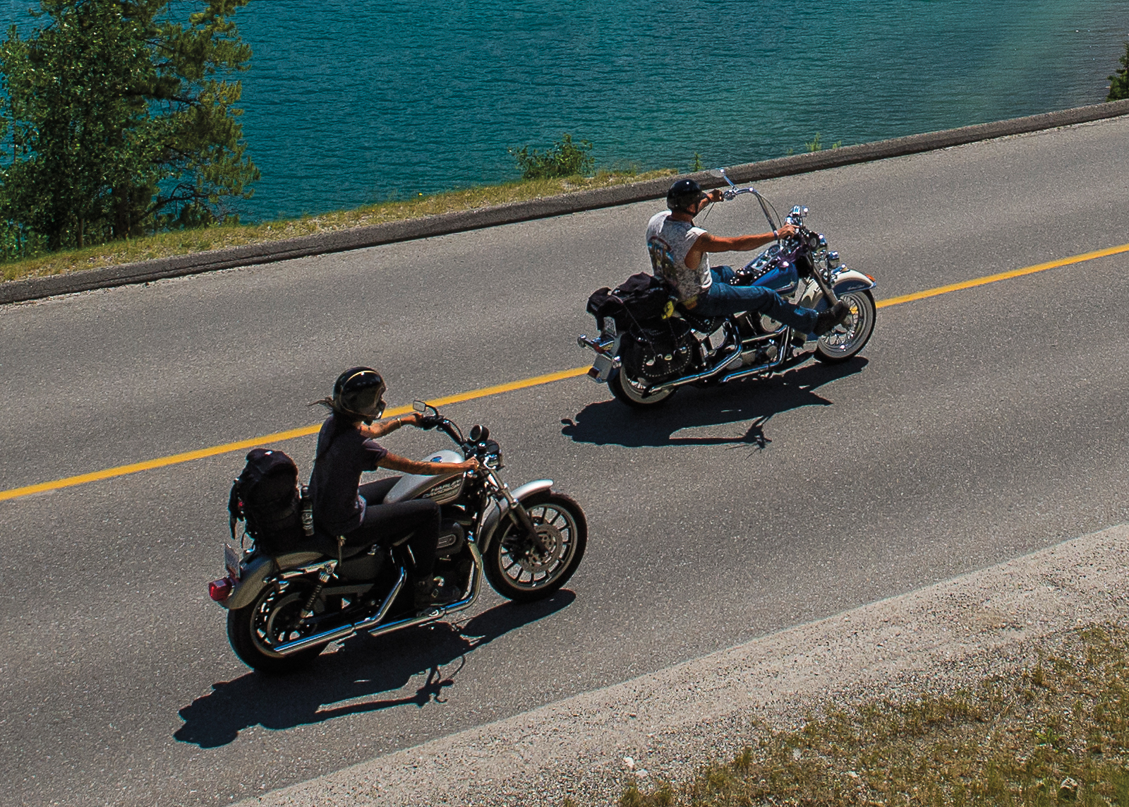 Overhead of man and woman riding their bikes by the water