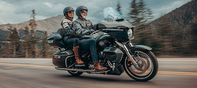 Man and woman riding a Street Glide Limited