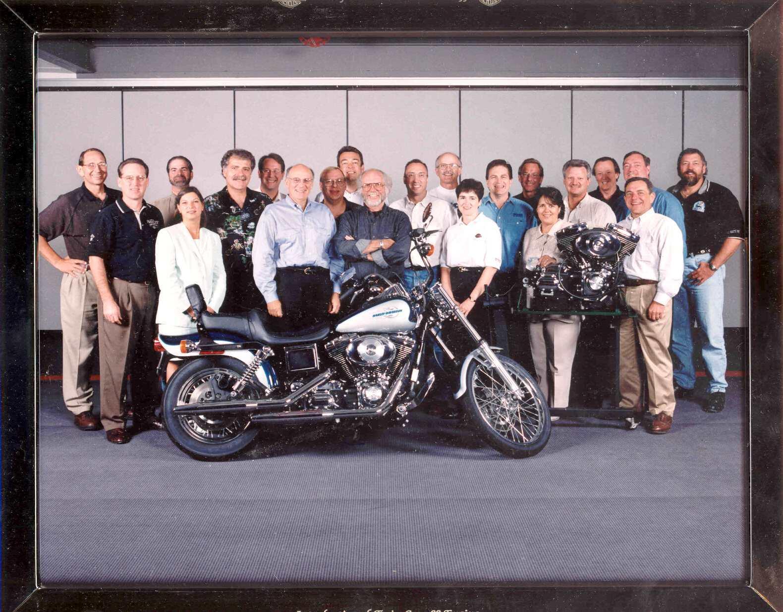 1988 executive staff posing behind twin can 88 engine