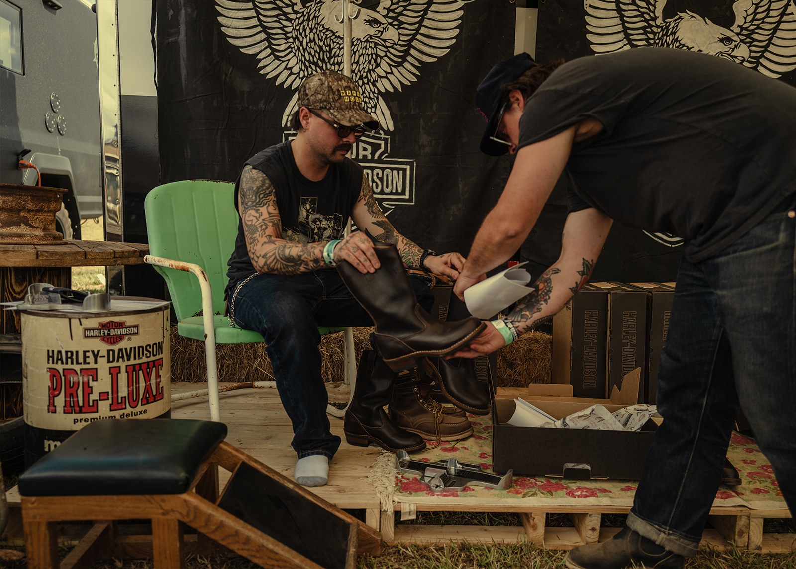 A rider tries on a pair of Harley-Davidson x White’s boots at the Born Free Texas rally.