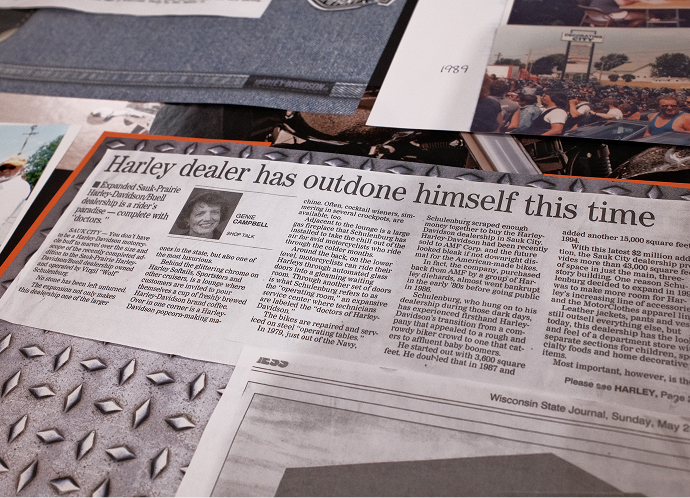 A vintage newspaper clipping about Virgil Schulenberg with the headline “Harley dealer has outdone himself this time”