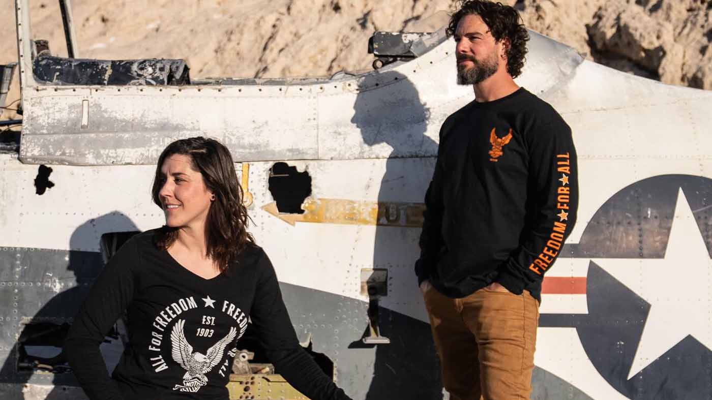 woman and man by an old plane