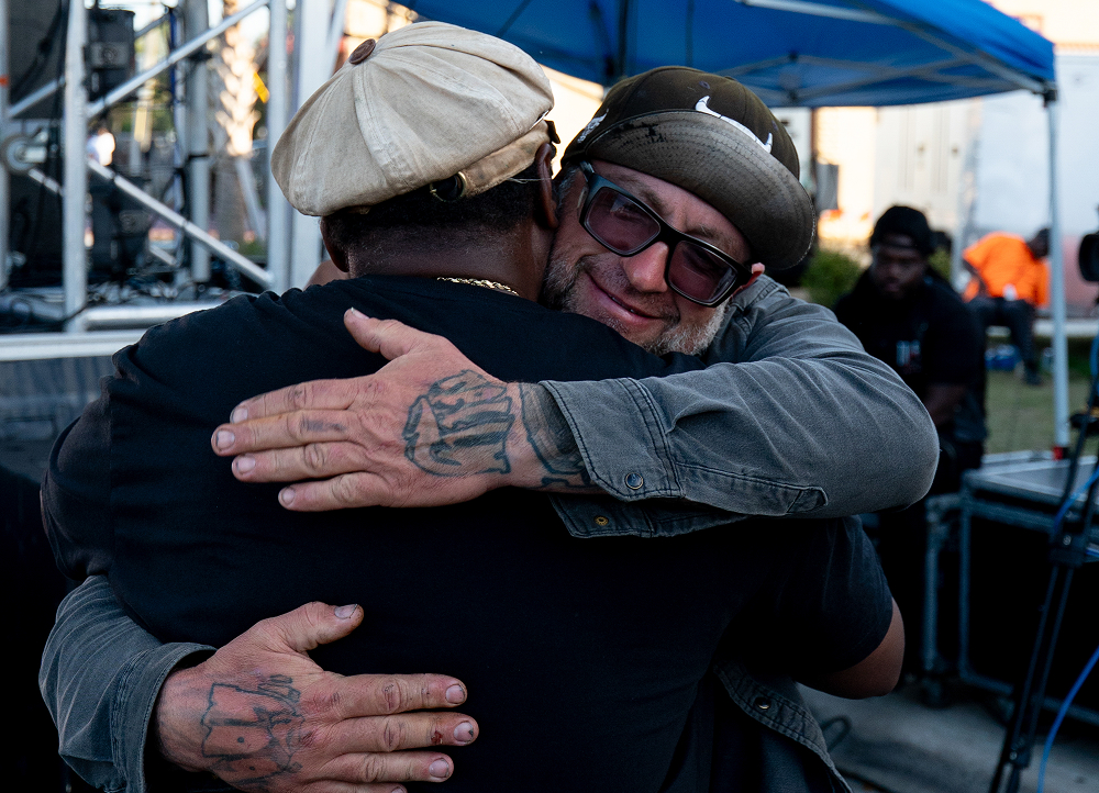 Randy “Detroit” Hayward hugs a bike builder after awarding them a DAM ring
