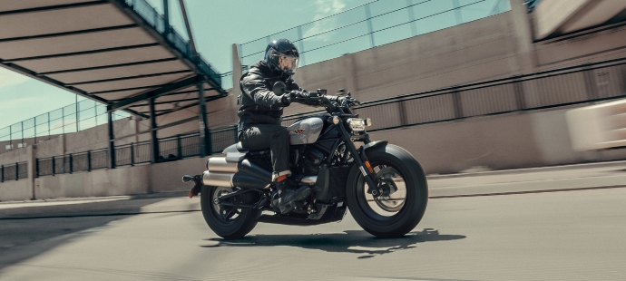 Sportster S motorcycle riding under a bridge fast
