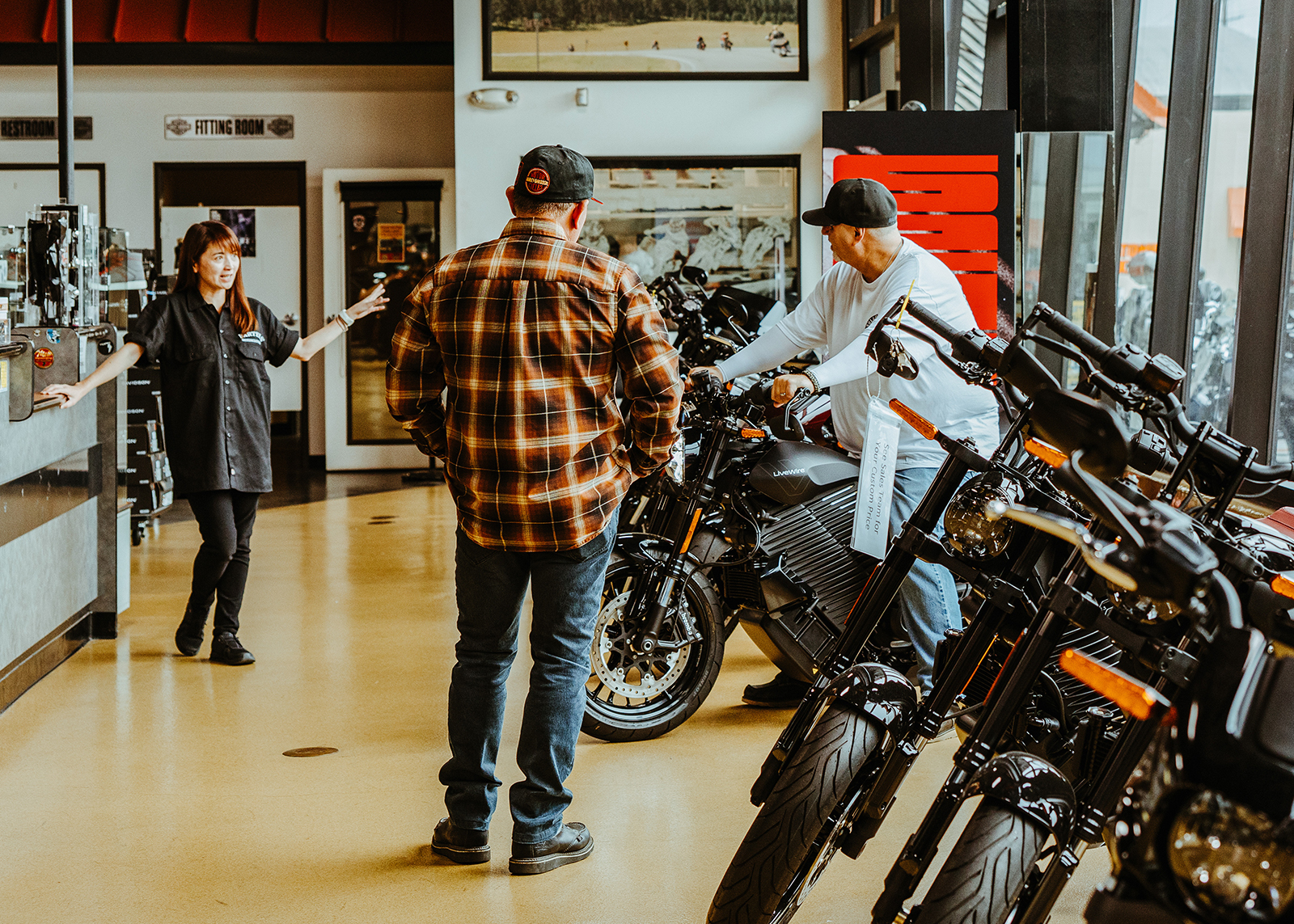 Bartel’s staff helping two customers on the showroom floor.