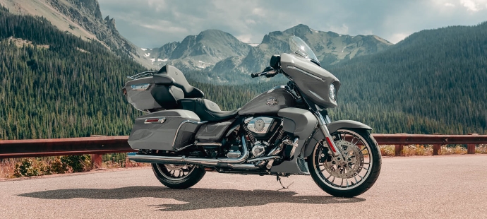 2026 Street Glide motorcycle parked at lookout with mountains and trees in the background