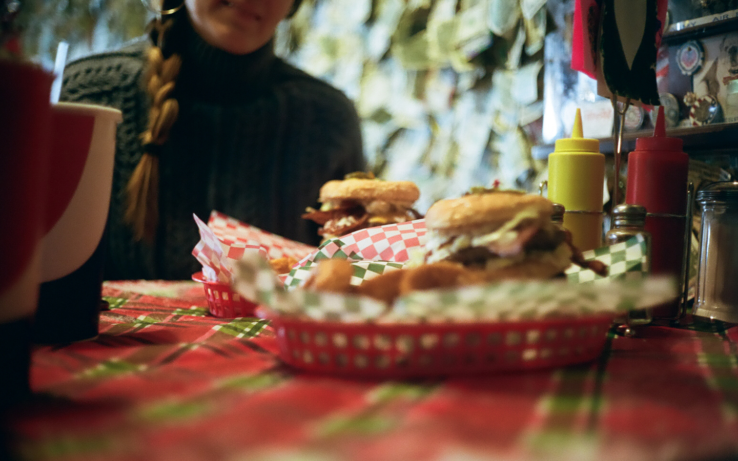 Burgers and fries on table
