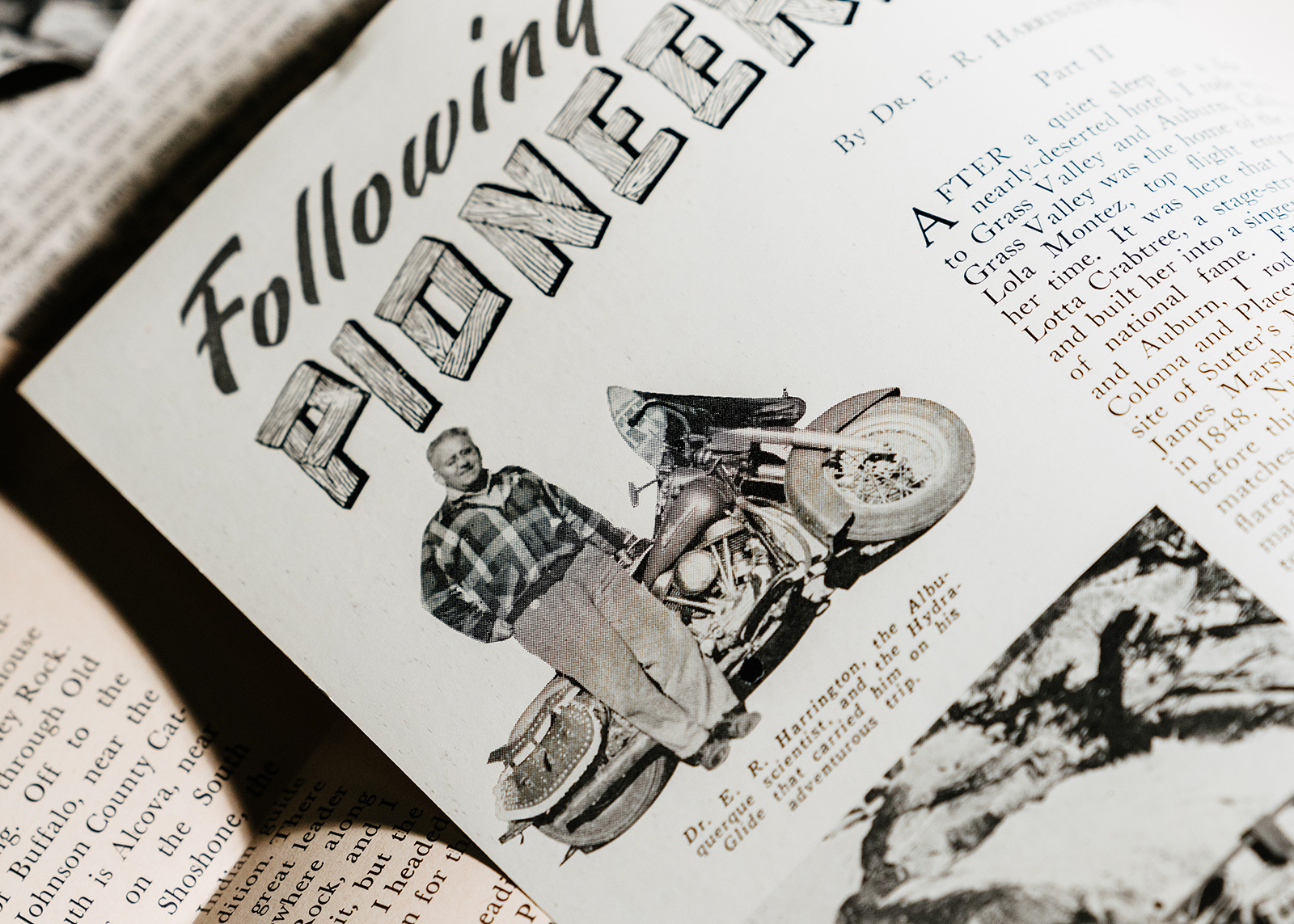 Magazine page titled Following Pioneers featuring a photo of Eldred standing beside his 1951 hydra-glide motorcycle.