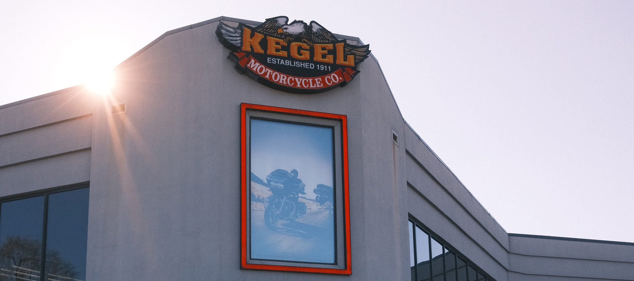 Exterior of Kegel Harley-Davidson with a Kegel Motorcycle Co. sign and a framed image of a motorcycle