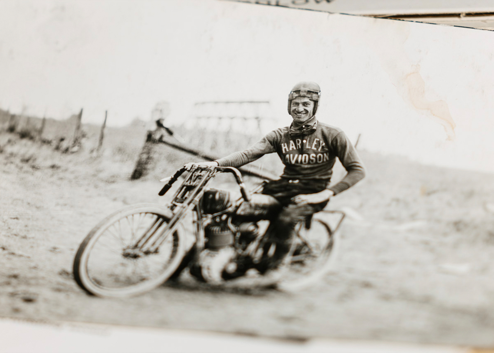 An old photograph shows Leslie “Red” Parkhurst sitting on his Harley in his riding gear.