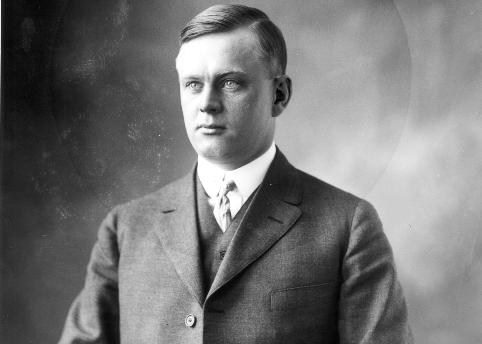 vintage black and white portrait of a man in a suit 