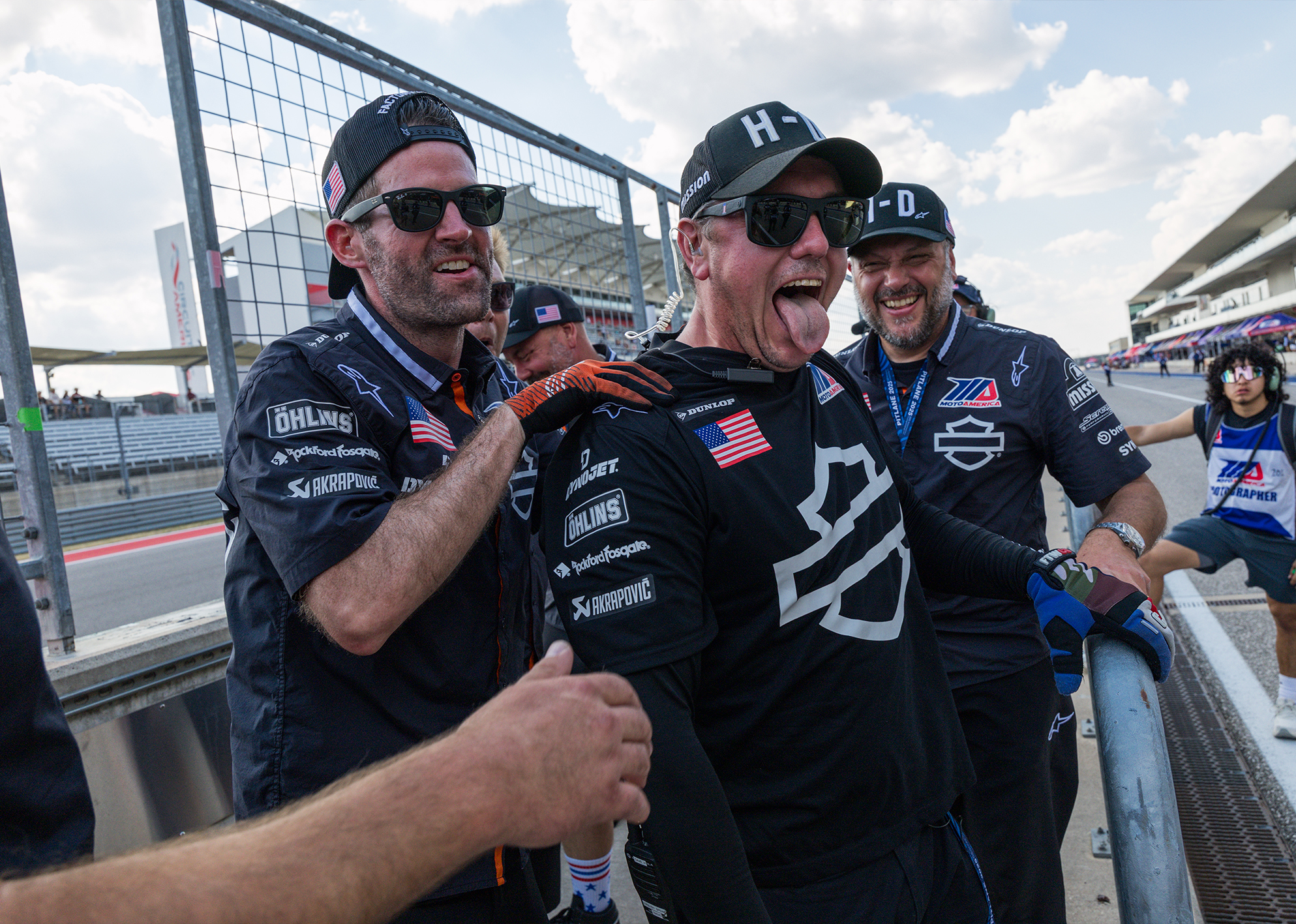 Harley-Davidson Factory Racing Lead Carl Vandervort celebrates winning a King of the Baggers race with his teammates in pit lane.