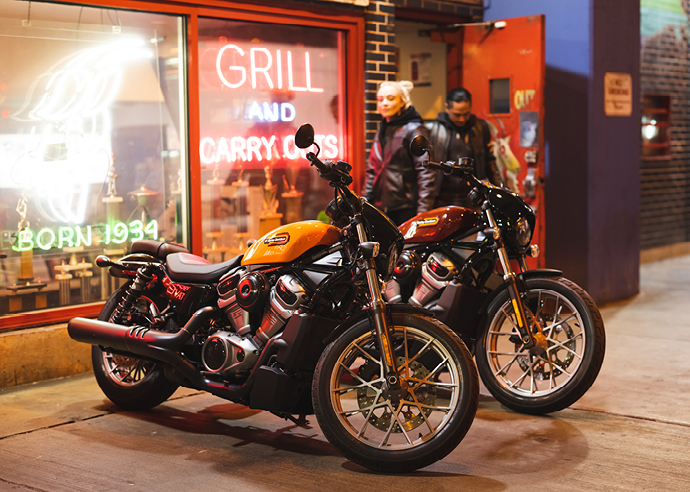 Two Nightster Special motorcycles parked outside of storefront