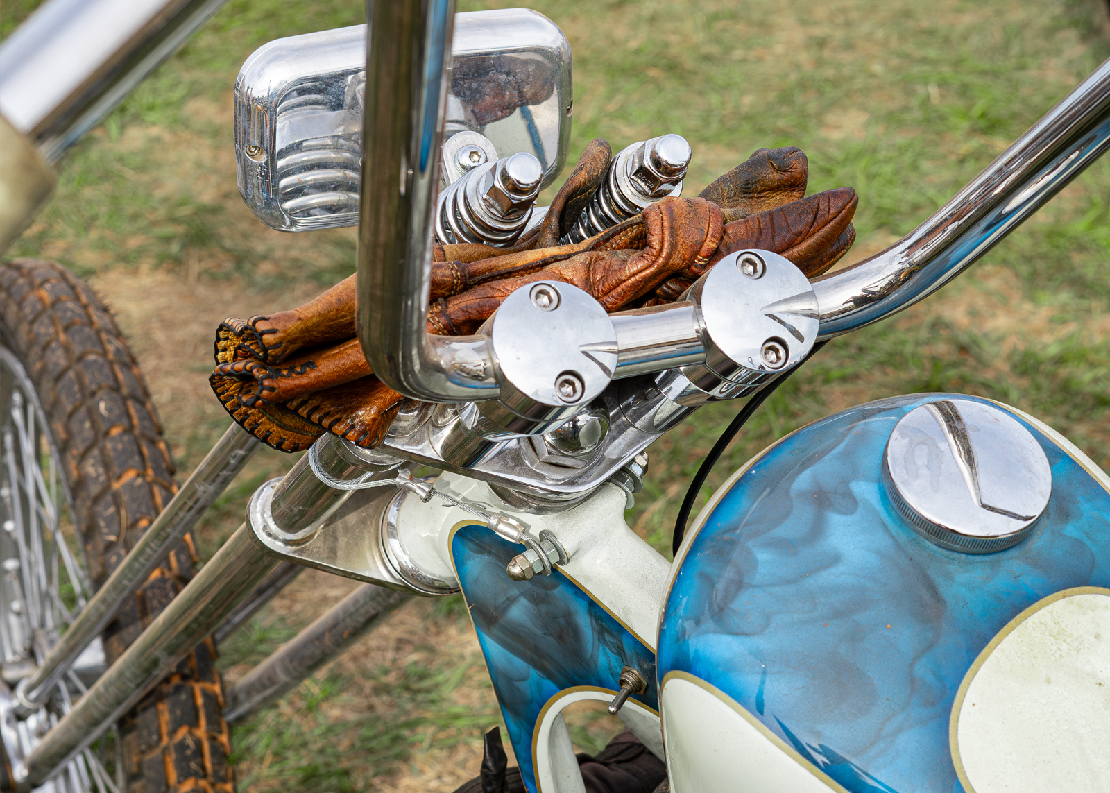 Leather gloves resting on the front of a bike