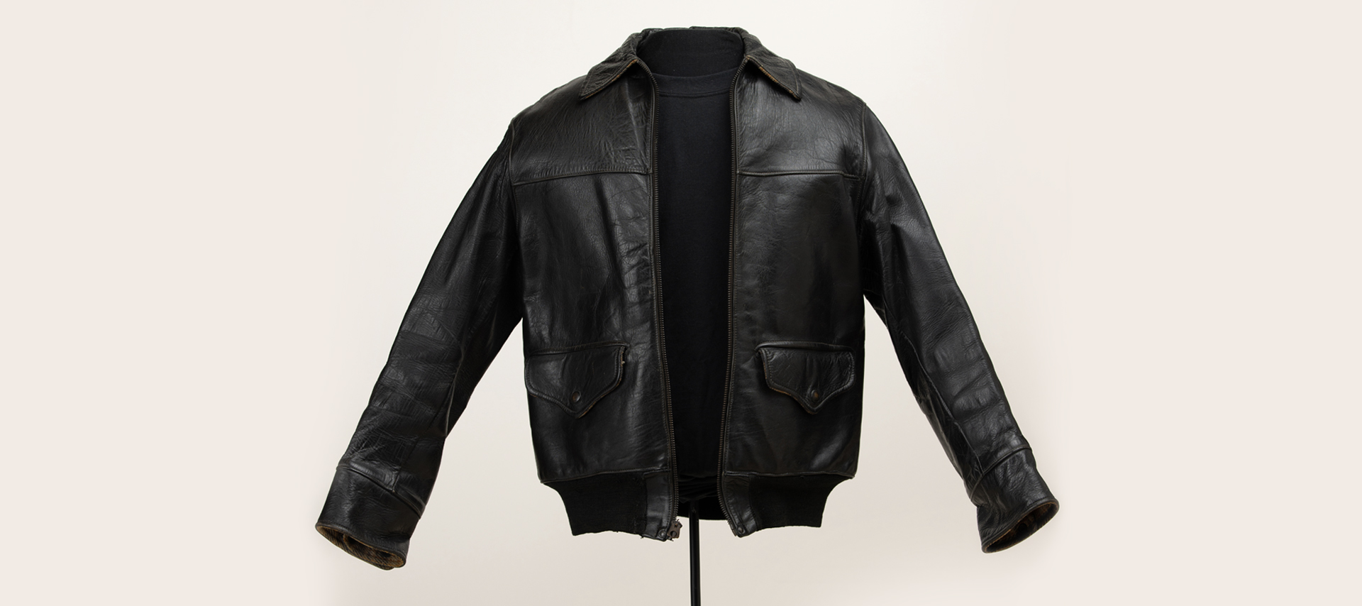 A vintage leather jacket on a mannequin