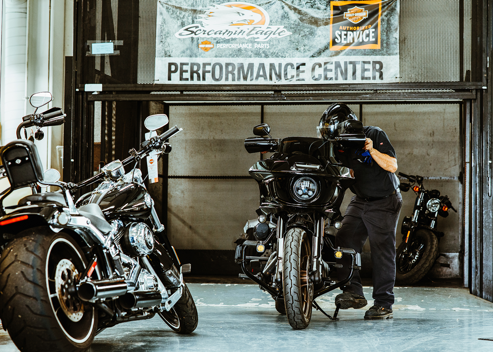 A rider and their bike in the Bartel’s service bay.