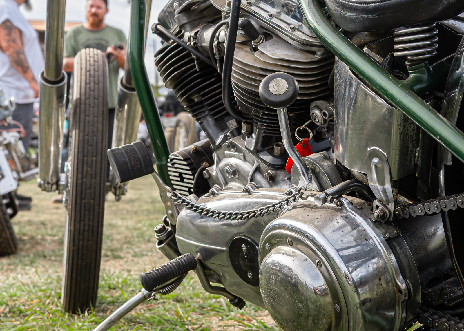 Close up of an engine on a bike with green frame