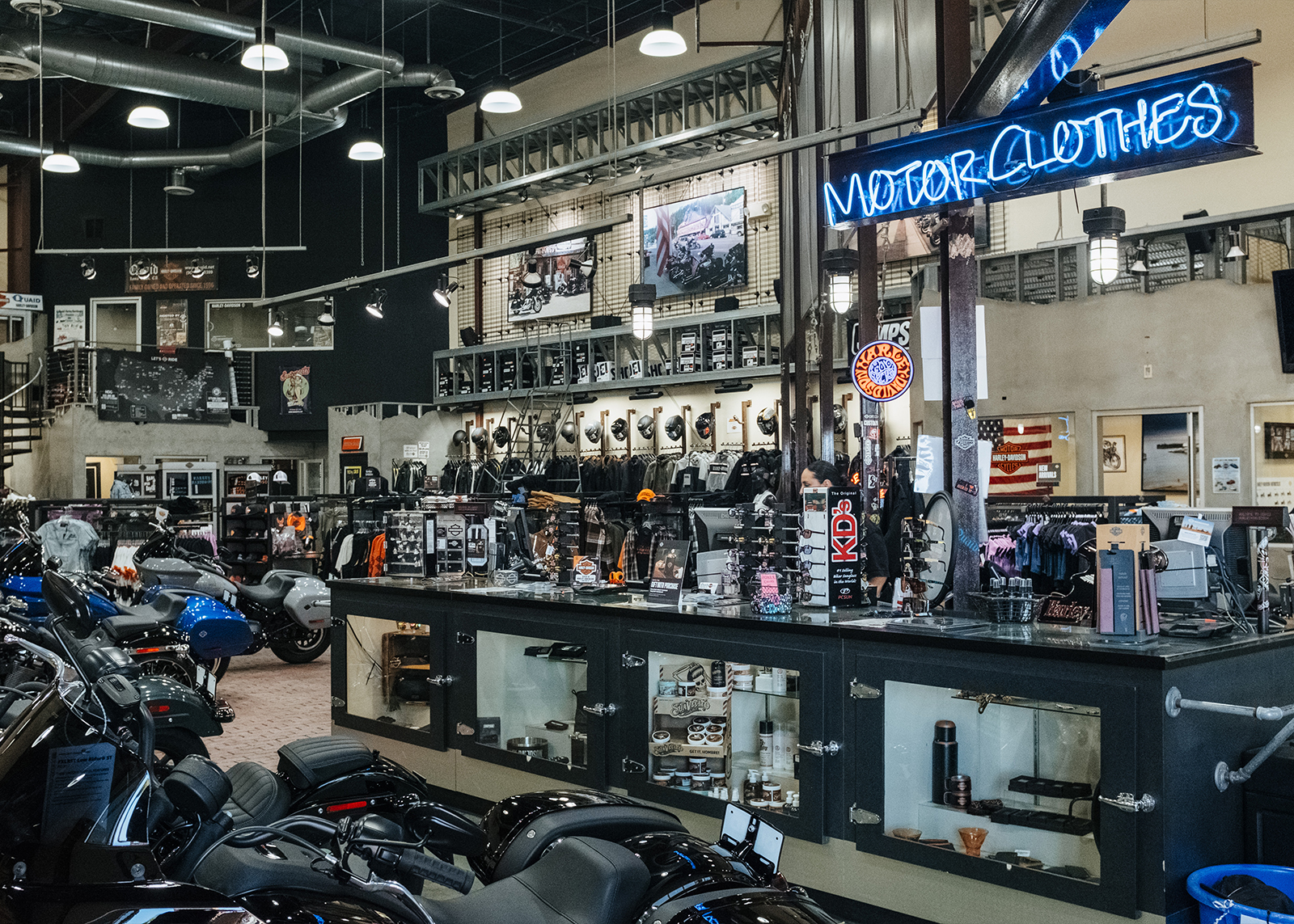 The floor of Quaid Harley-Davidson dealership with motorcycles and accessories on display.