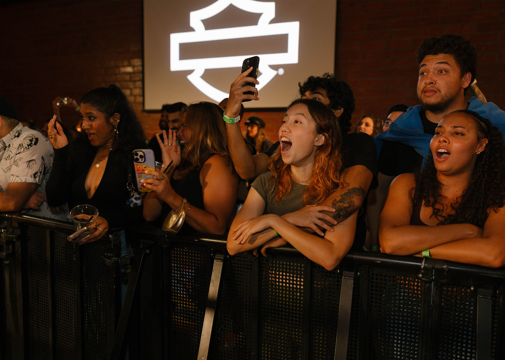 Spectators react to a boxing match during the Harley-Davidson Fight Night event.