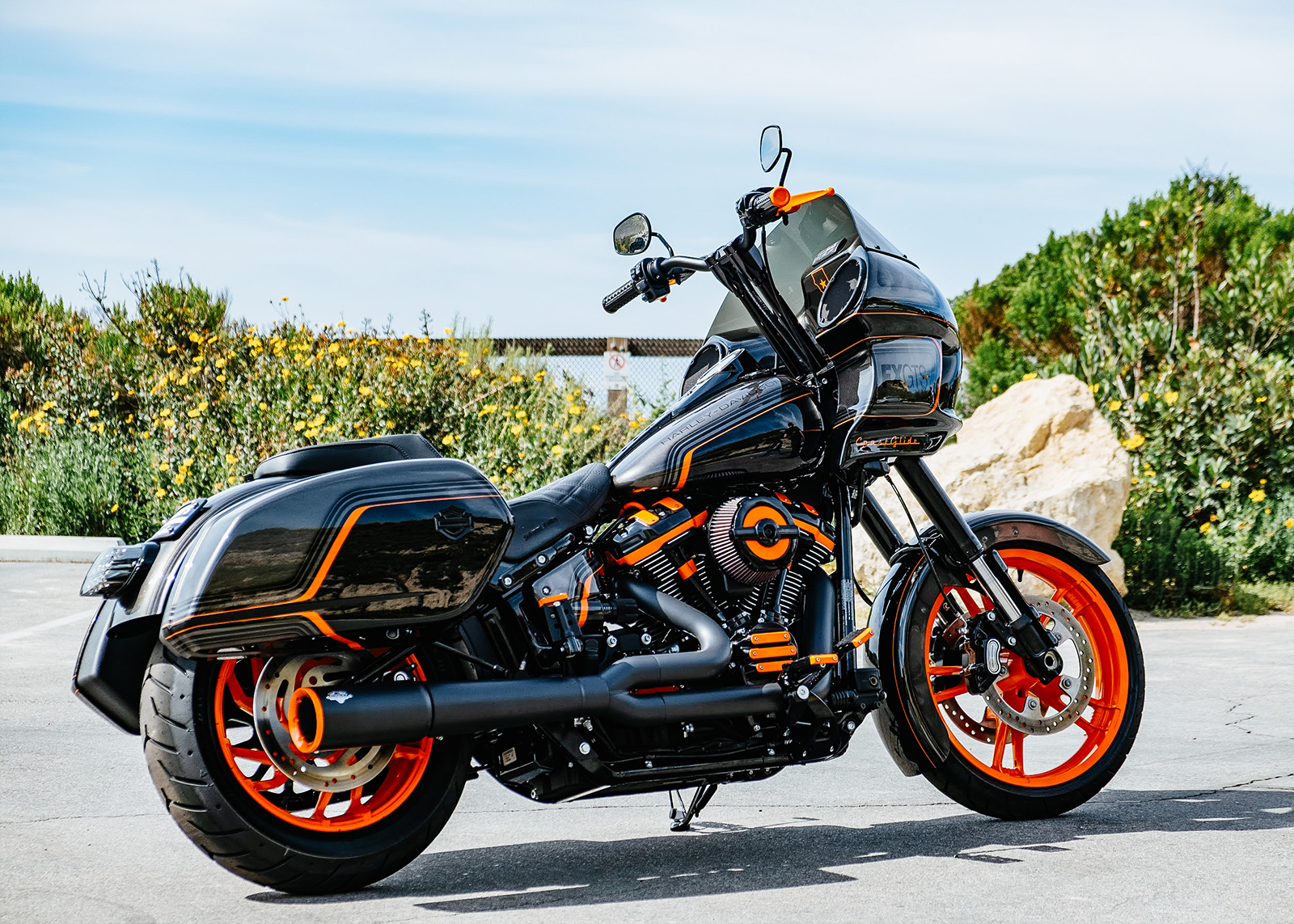 Laidlaw’s custom built motorcycle, The Laidlaw Coastglide, seen from the rear three-quarter view.