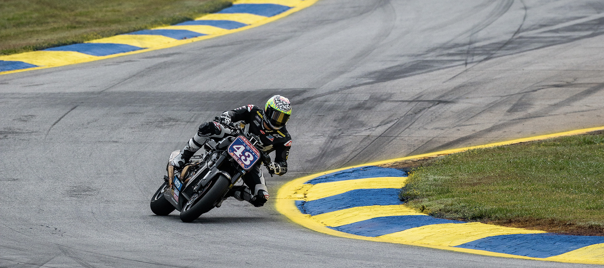 James Rispoli navigates an s curve during a race.