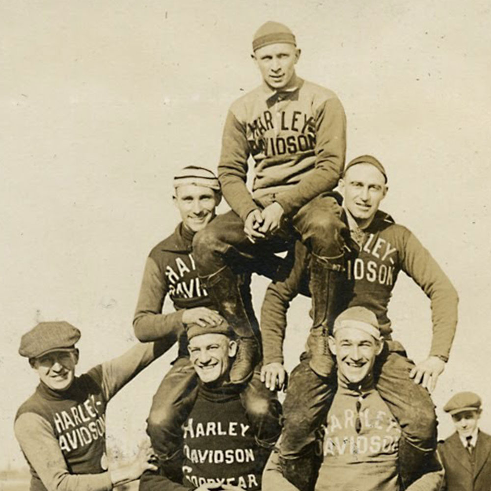 men making human pyramid black & white image